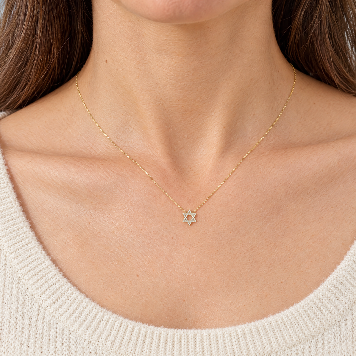 Dainty gold Star of David necklace worn at real size, 11 x 9.5 mm