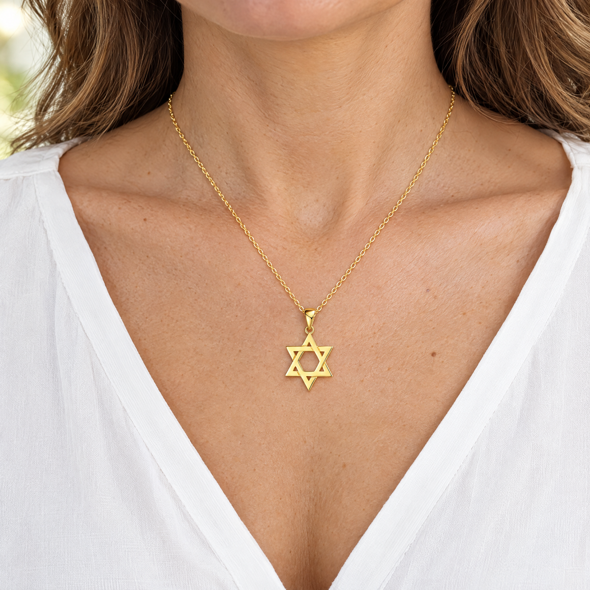 Gold Magen David necklace in sterling silver worn, shown at real size (20 x 12 mm)
