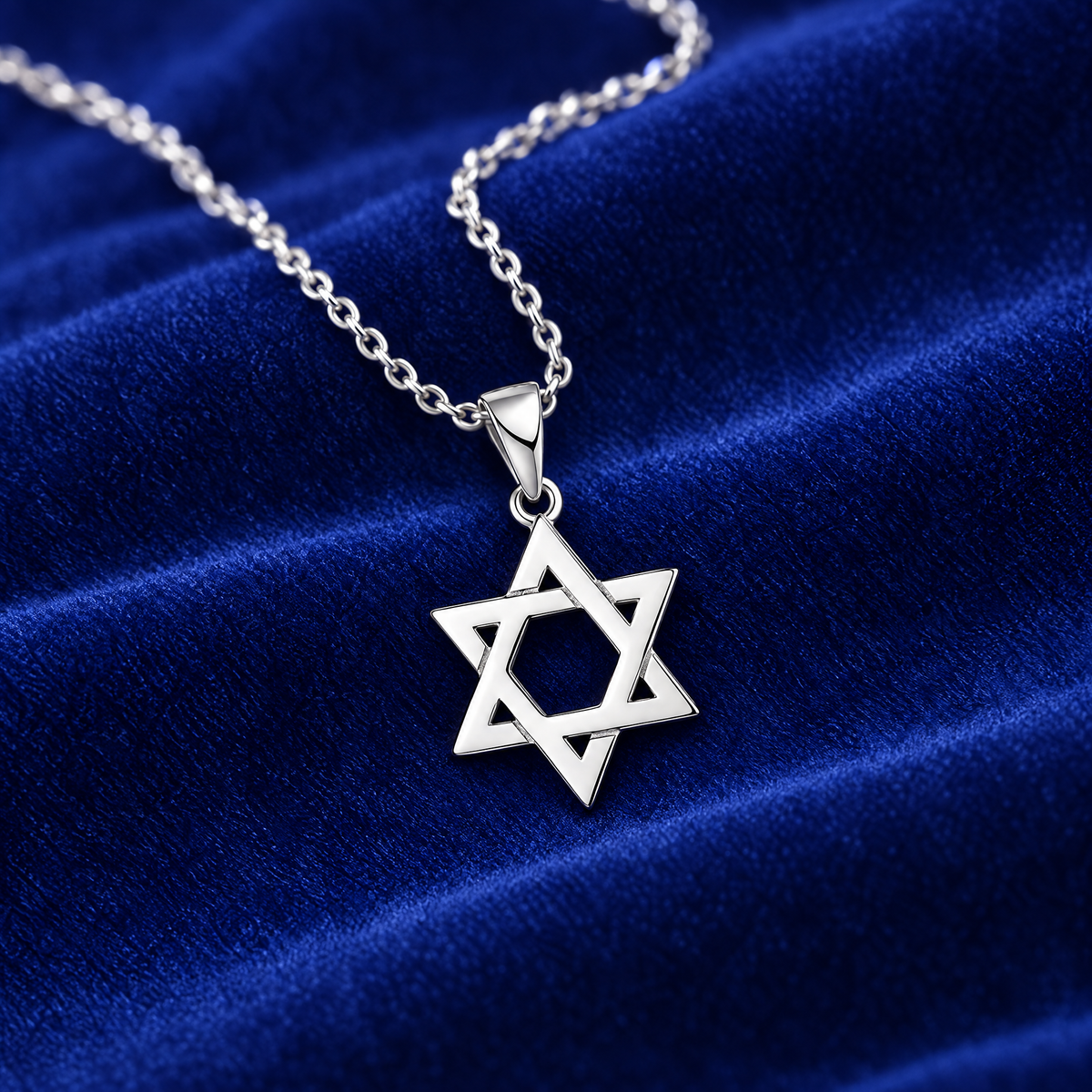 Classic Magen David necklace in sterling silver on royal blue velvet