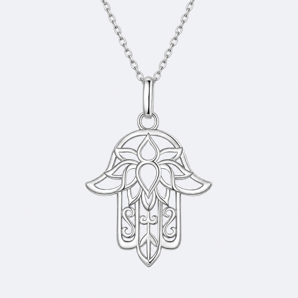 Lace hamsa necklace in sterling silver, studio photo