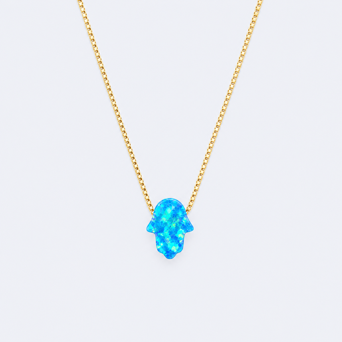 Blue opal hamsa necklace, studio photo