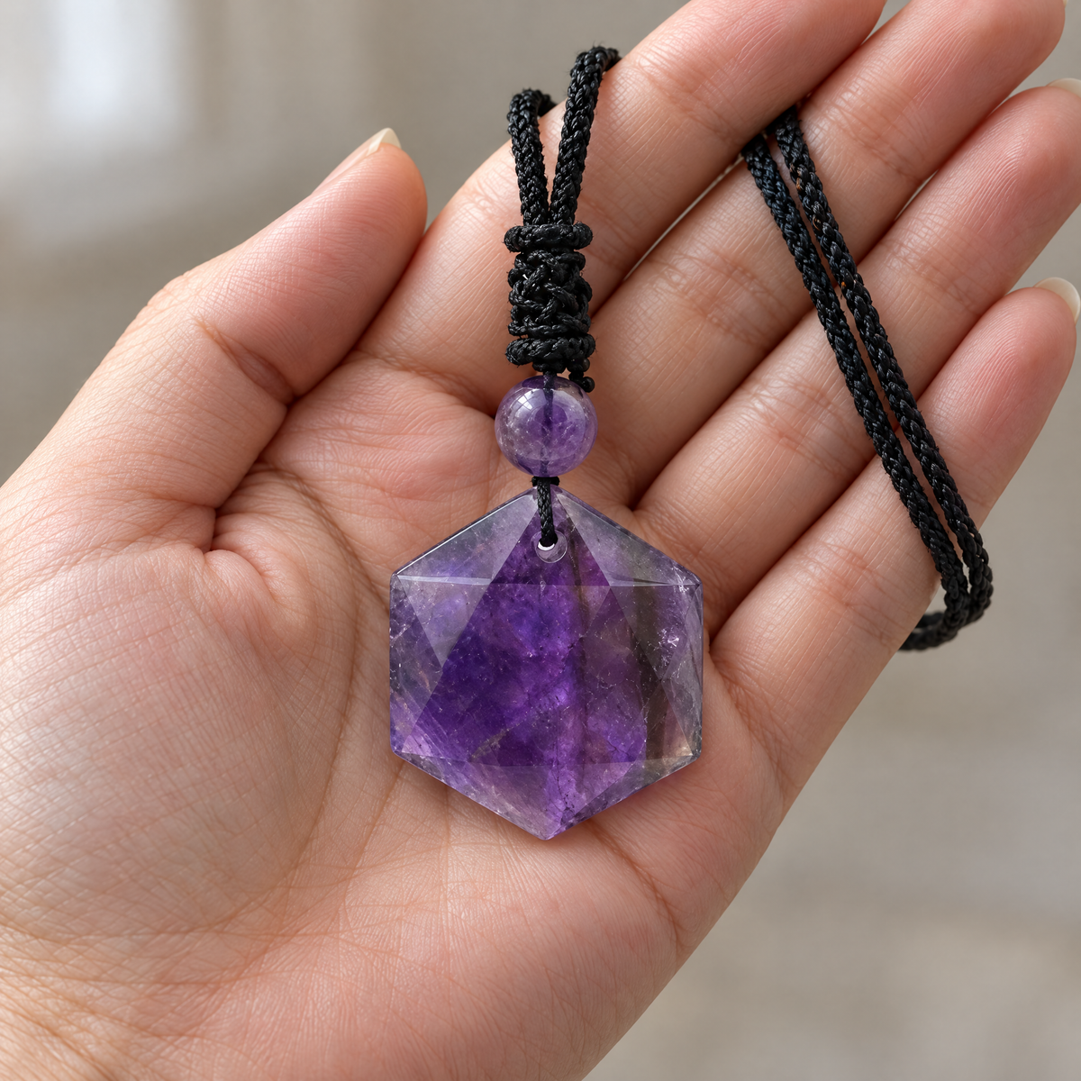 Amethyst Star of David pendant in the hand, to show its real size (29 x 29 mm)