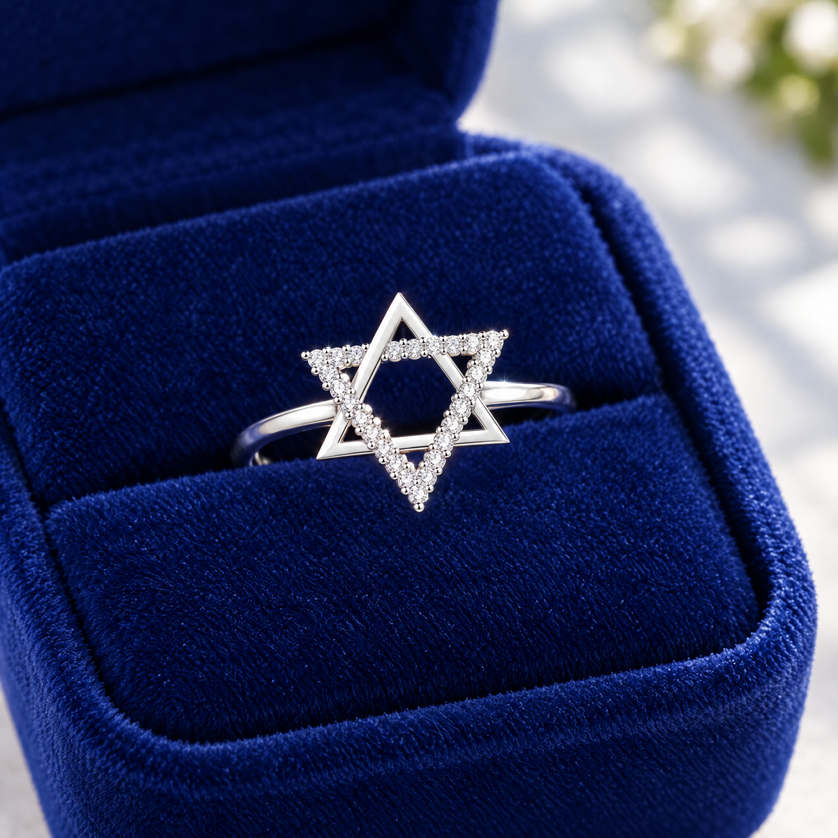Star of David ring in sterling silver on royal blue velvet