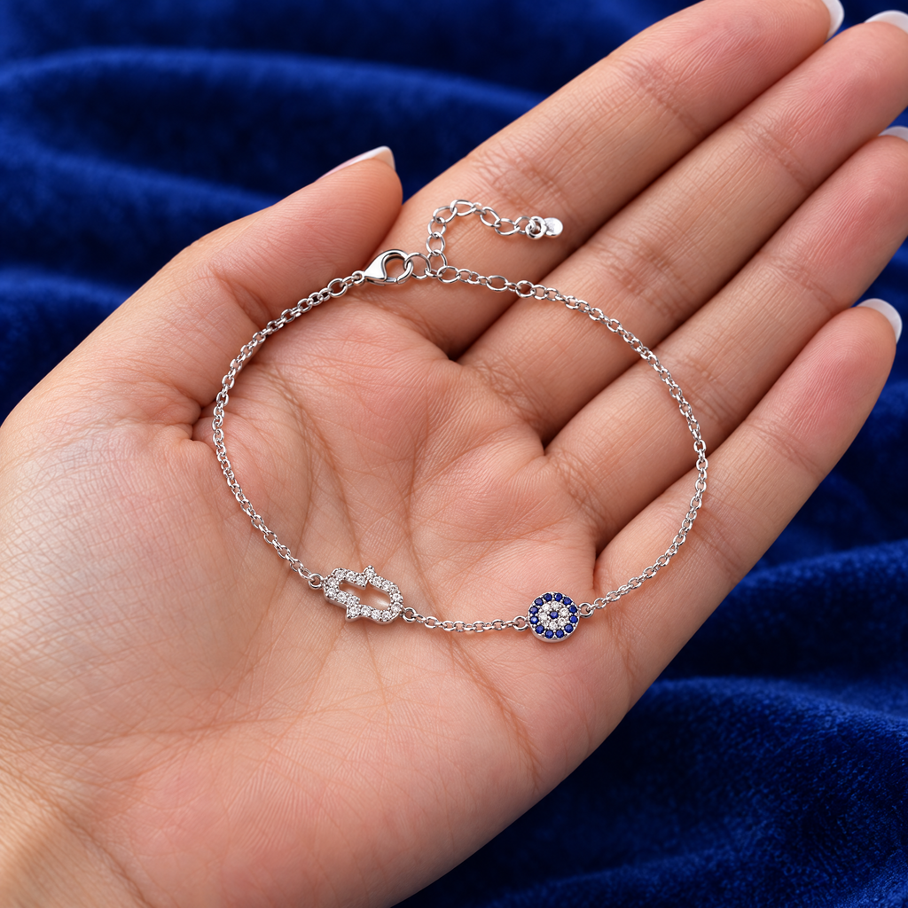 Hamsa and blue eye bracelet in sterling silver in the hand, to show its real size (10 mm hamsa)