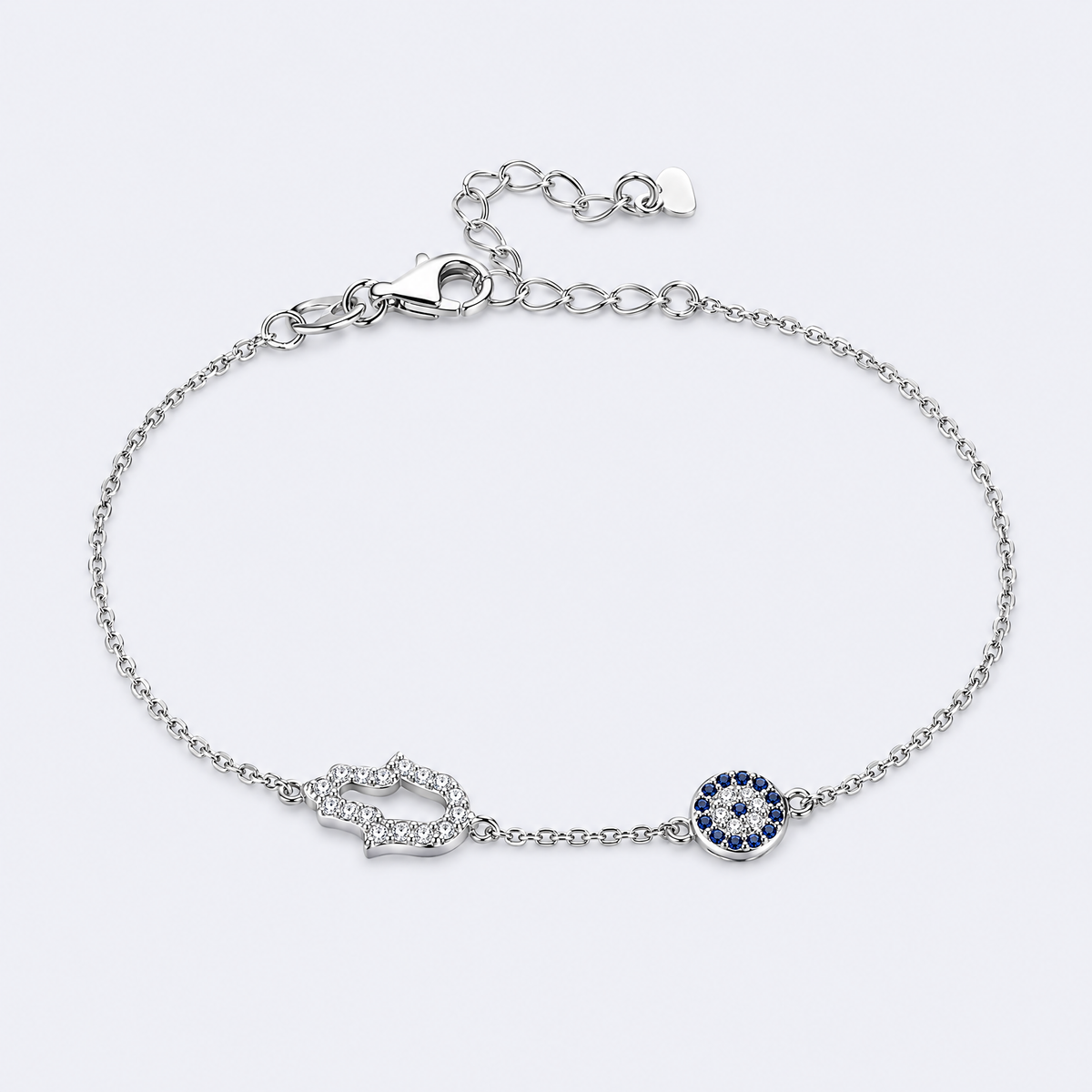 Hamsa and blue eye bracelet in sterling silver, studio photo