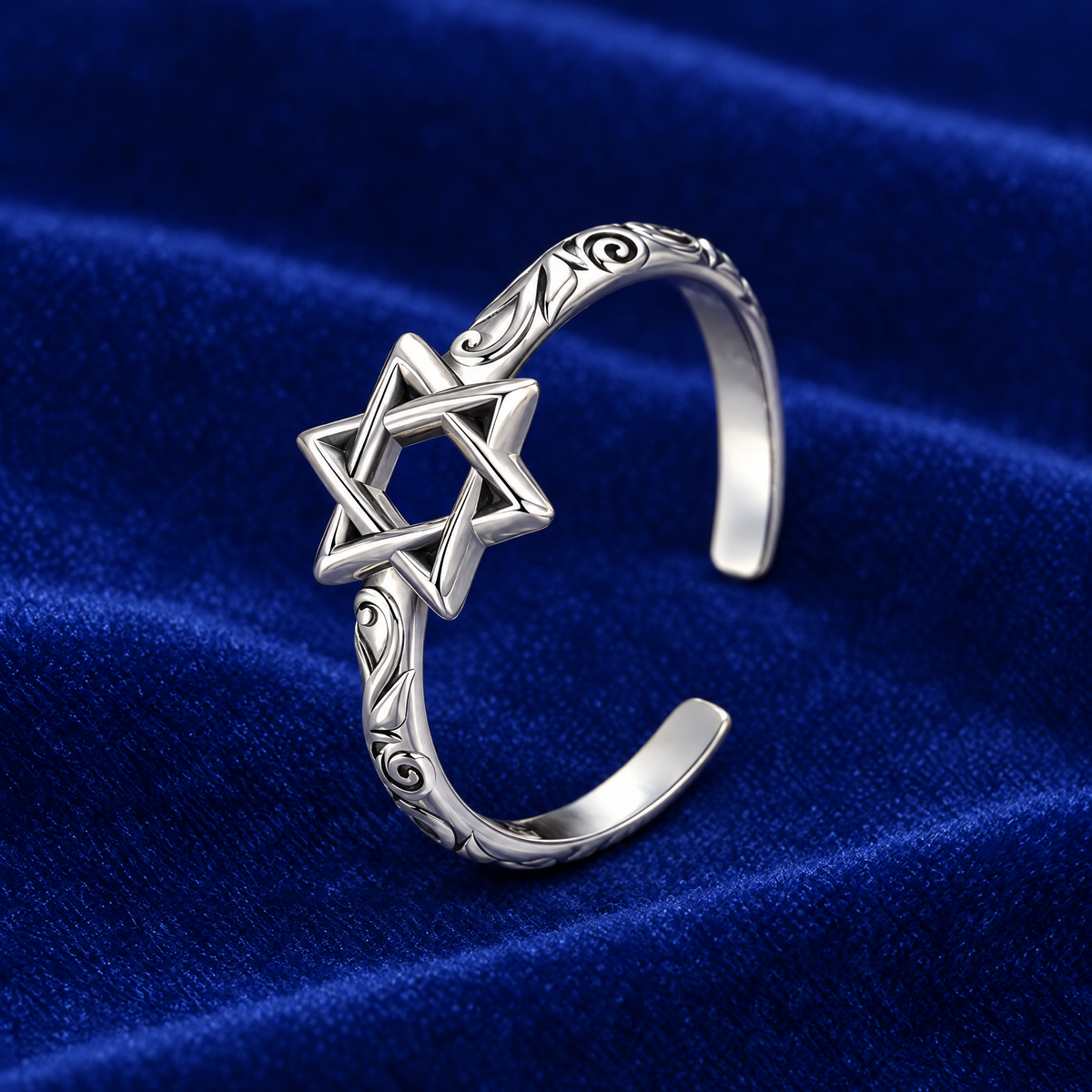 Adjustable Star of David ring in sterling silver on royal blue velvet