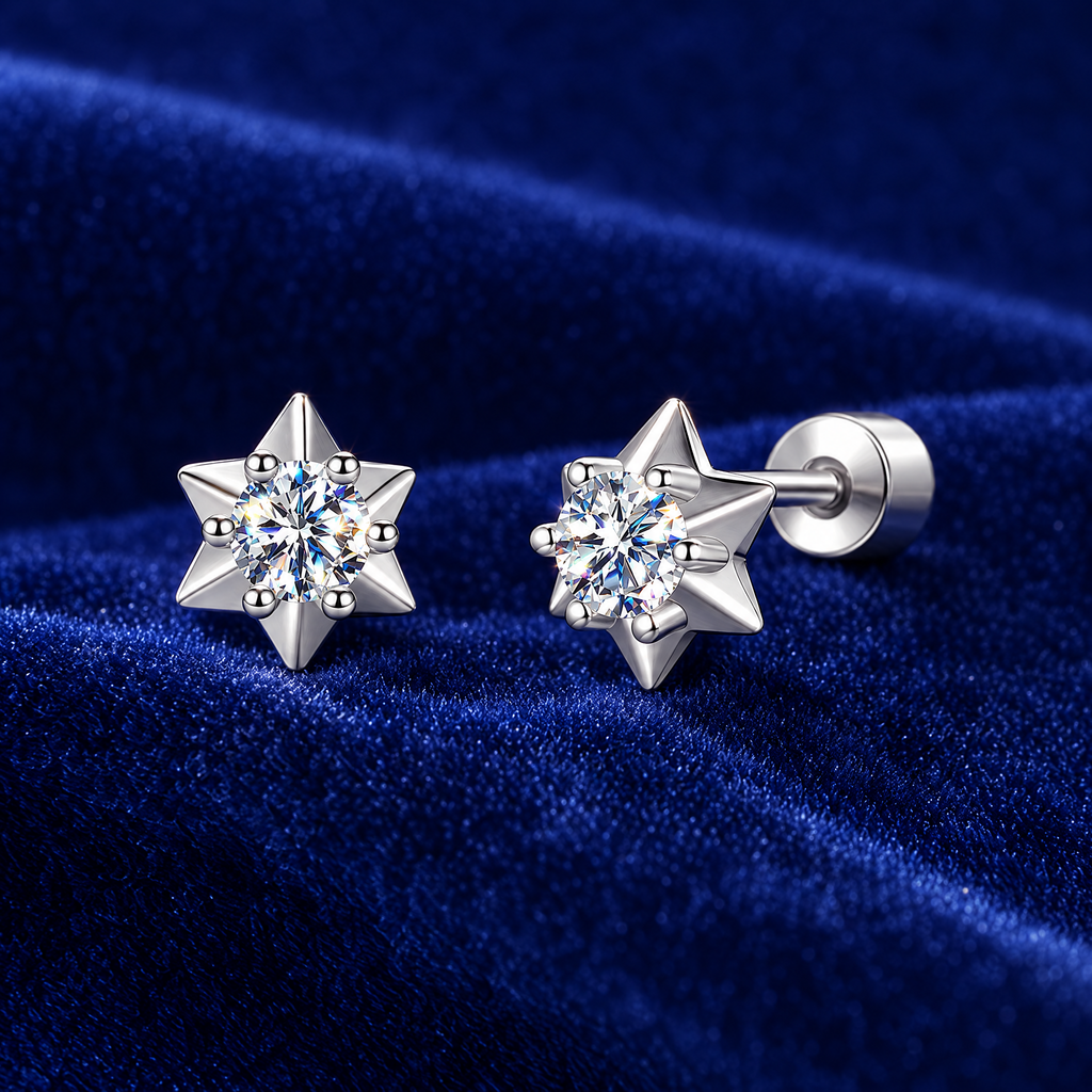 Moissanite star stud earrings in sterling silver on royal blue velvet