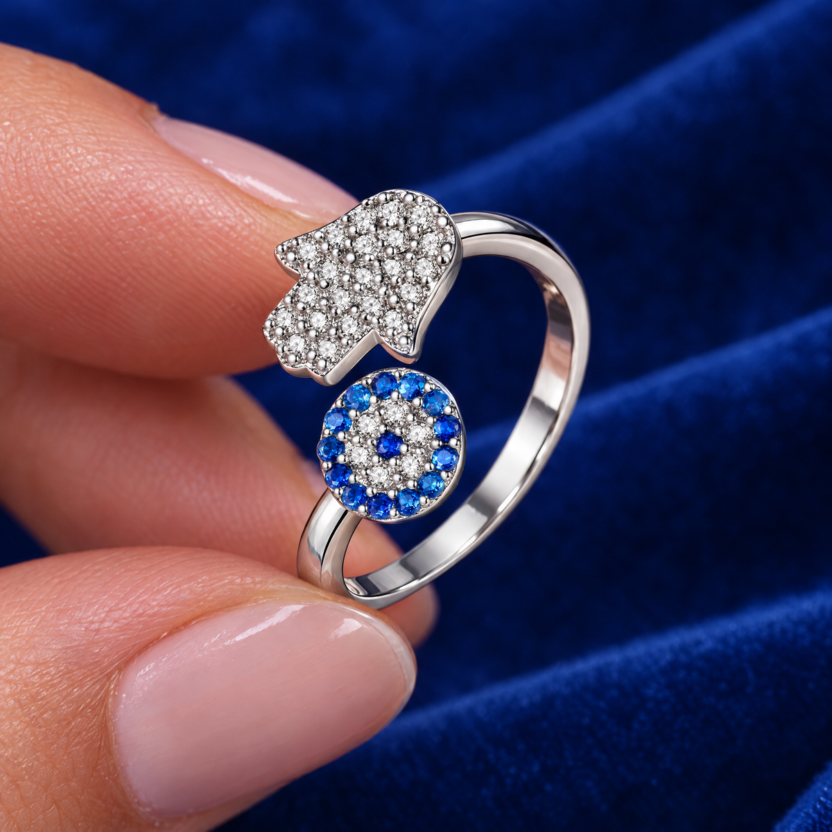 Adjustable hamsa and blue eye ring in sterling silver in the hand, to show its real size (9 mm hamsa)