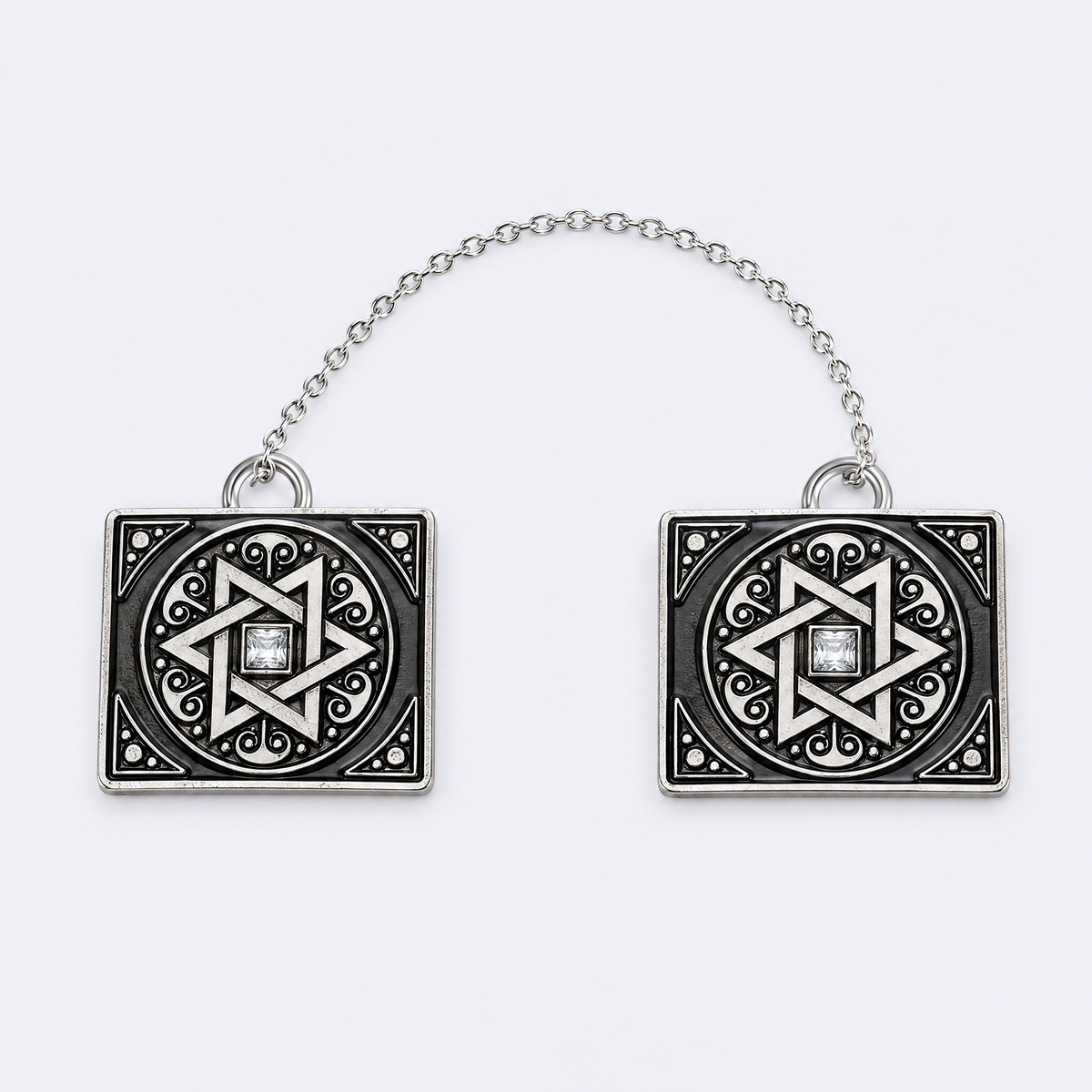 Star of David tallit clips, studio photo