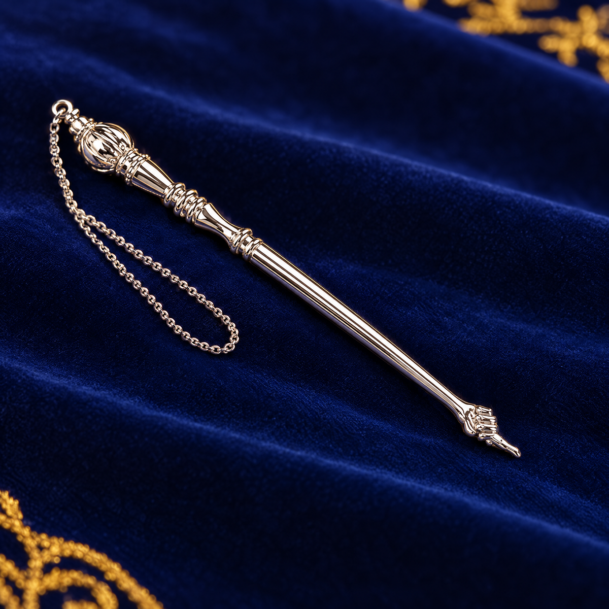 Silver Torah pointer (yad) on royal blue velvet