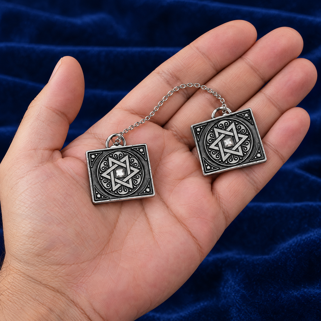 Star of David tallit clips in the hand, to show their real size