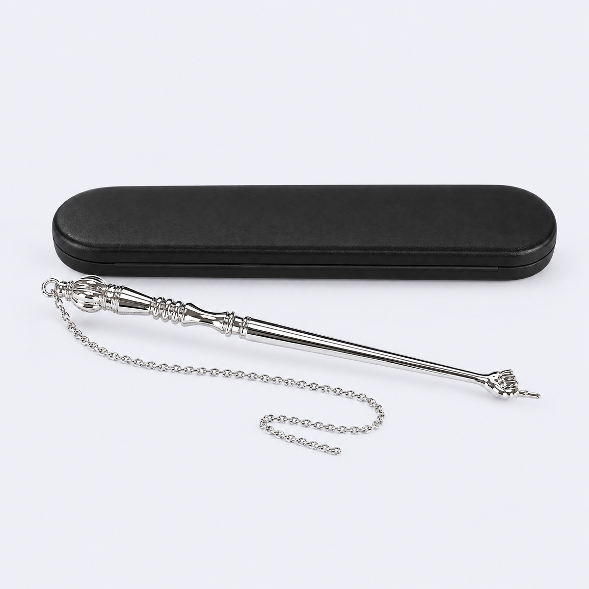 Silver Torah pointer (yad) with its gift case, studio photo