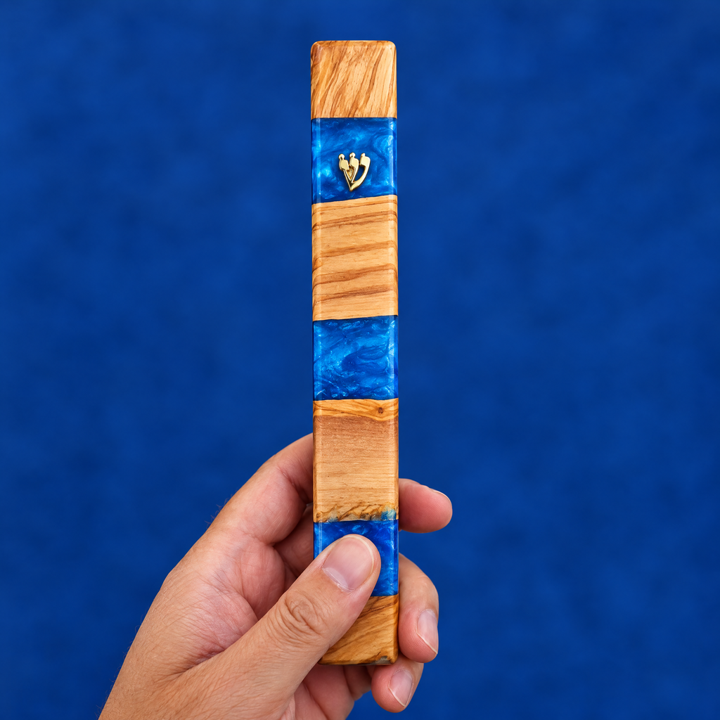 Olive wood and blue resin mezuzah case in the hand, to show its real size (18 x 3.2 cm)