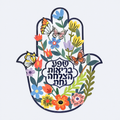 Painted iron hamsa wall art with a Hebrew home blessing, studio photo