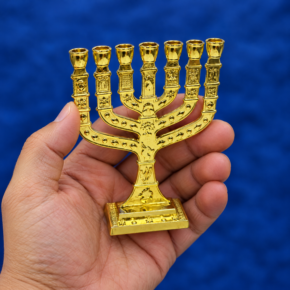 Seven-branch menorah in the hand, to show its real size (11.5 x 8.5 cm)